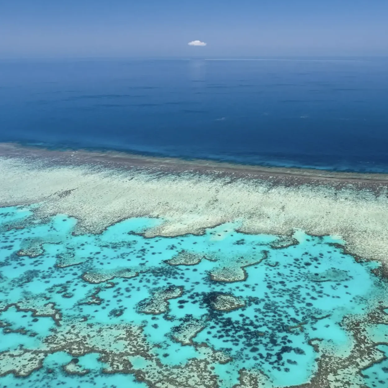 breaking waves over shallow reef near Fitzroy Island